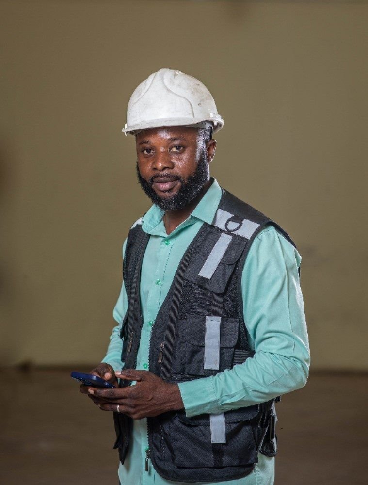Transit Cargo Limited operations staff member in a hard hat and safety vest