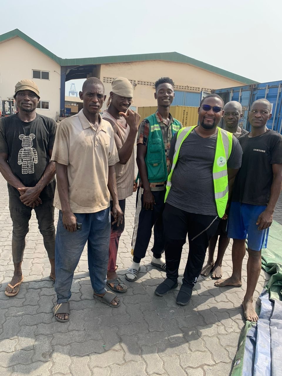 Transit Cargo Limited dock and yard crew standing together at a warehouse in Tema
