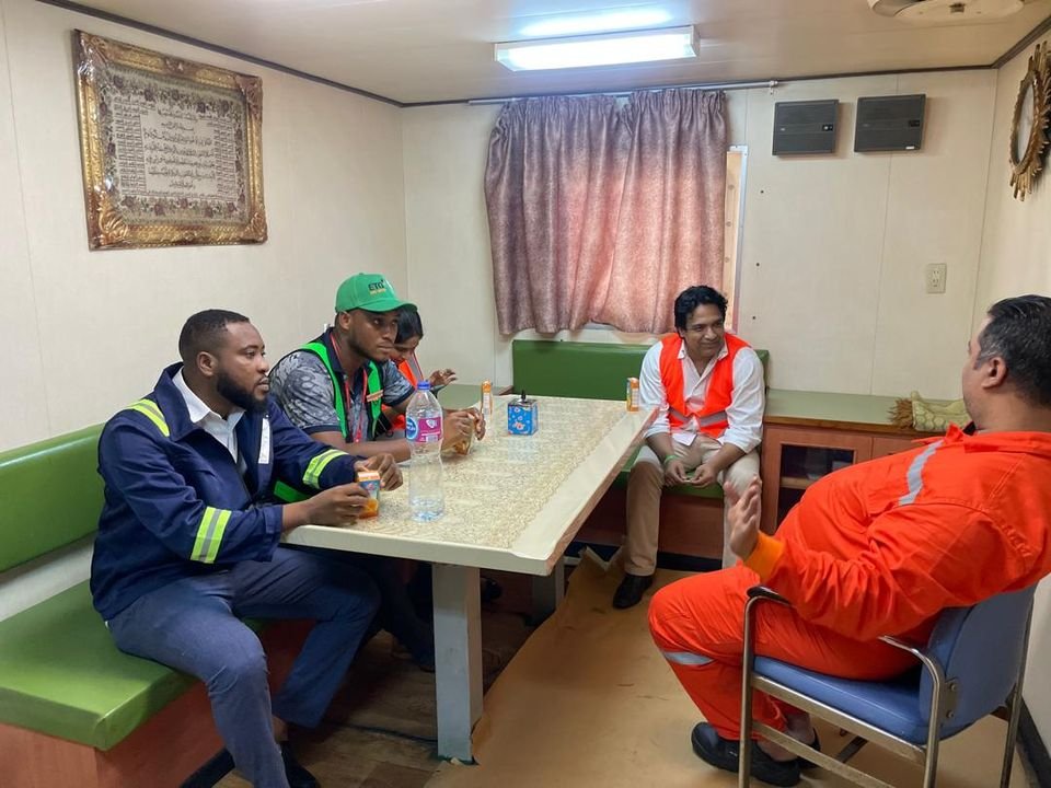 Transit Cargo Limited staff meeting clients in an office